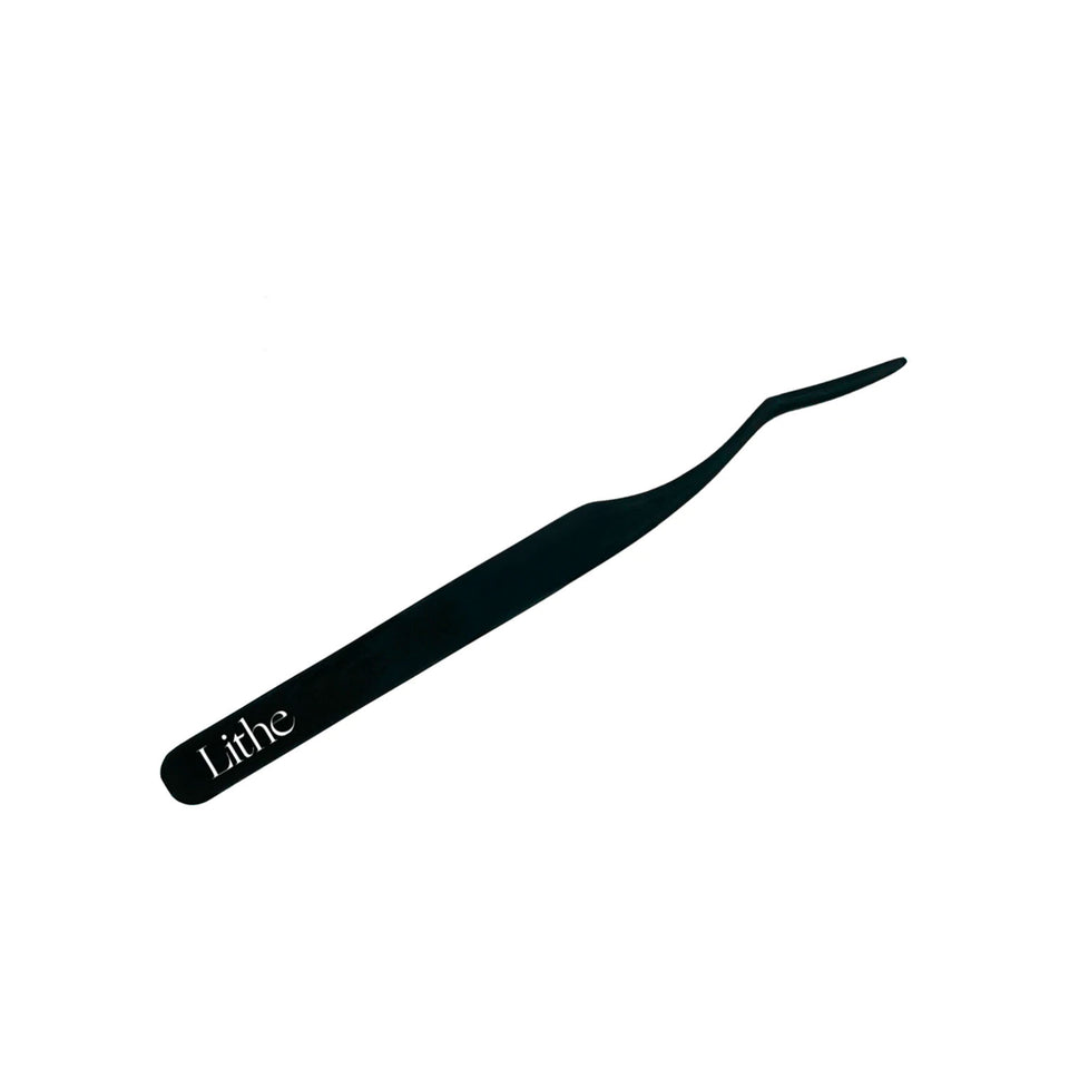 Lithe Lashes false lashes accessories, Lash Applicator. A matte black and ergonomic applicator tool to help in the false lashes application process. The matte black tool is shown in high definition on a white background.