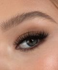 Lithe Lashes Bold Collection Style B1 - Tapered & Winged, a close up eye thumbnail image of the model's eye wearing the false lashes for an up close perspective on how elegant the falsies look on the eye.