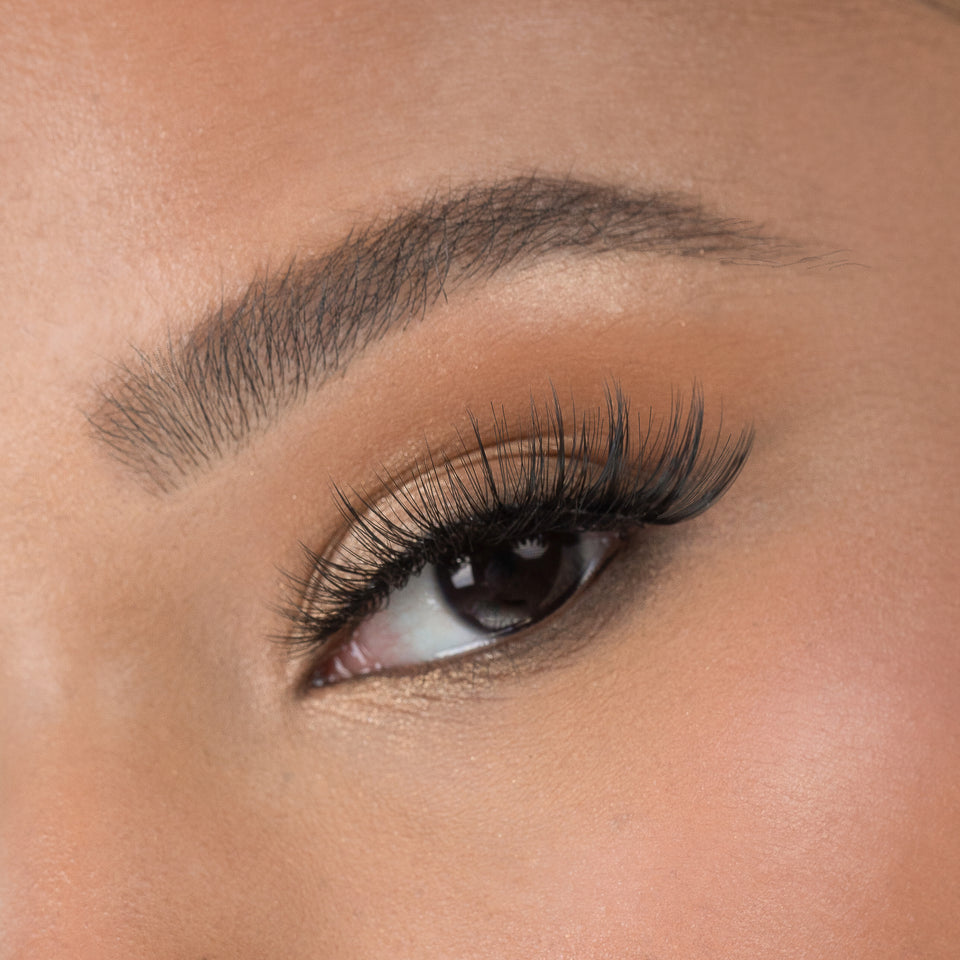 Lithe Lashes Bold Collection Style B2 - Full Flare, a close up eye thumbnail image of the model's eye wearing the false lashes for an up close perspective on how elegant the falsies look on the eye.