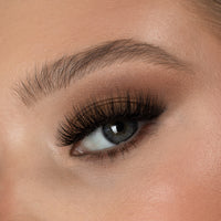 Lithe Lashes Bold Collection Style B3 - Kabuki, a close up eye thumbnail image of the model's eye wearing the false lashes for an up close perspective on how elegant the falsies look on the eye.