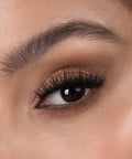Lithe Lashes Bold Collection Style B6 - Prim & Pleated, a close up eye thumbnail image of the model's eye wearing the false lashes for an up close perspective on how elegant the falsies look on the eye.