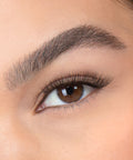 Lithe Lashes, Nude Collection, N1 Minimally Winged,  a close up eye thumbnail image of the model's eye wearing the false lashes for an up close perspective on how elegant the falsies look on the eye.
