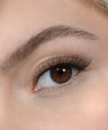 Lithe Lashes, Nude Collection, N4 - Semi Flared, a close up eye thumbnail image of the model's eye wearing the false lashes for an up close perspective on how elegant the falsies look on the eye.