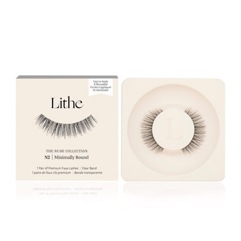 Lithe Lashes Nude Collection Style N2 Minimally Round, product image with a single pair of false eyelashes resting in their cream coloured biodegradable plastic tray on right side of the image, and on the left side of the image is the cream coloured paper sleeve showing a high definition image of a single lash on the front, with the logo in the centre and in the upper right the callouts of easy to apply and reusable.