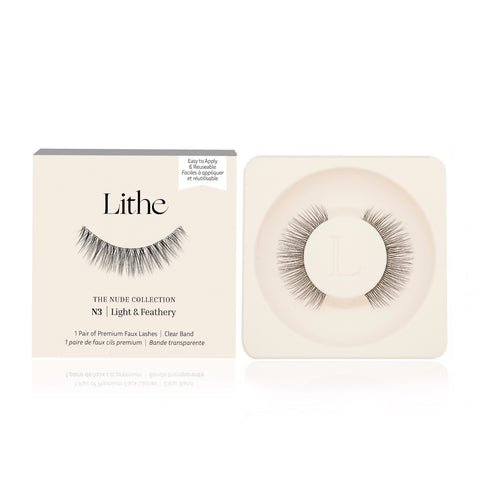 Lithe Lashes Nude Collection Style N3 Light & Feathery product image with a single pair of false eyelashes resting in their cream coloured biodegradable plastic tray on right side of the image, and on the left side of the image is the cream coloured paper sleeve showing a high definition image of a single lash on the front, with the logo in the centre and in the upper right the callouts of easy to apply and reusable.