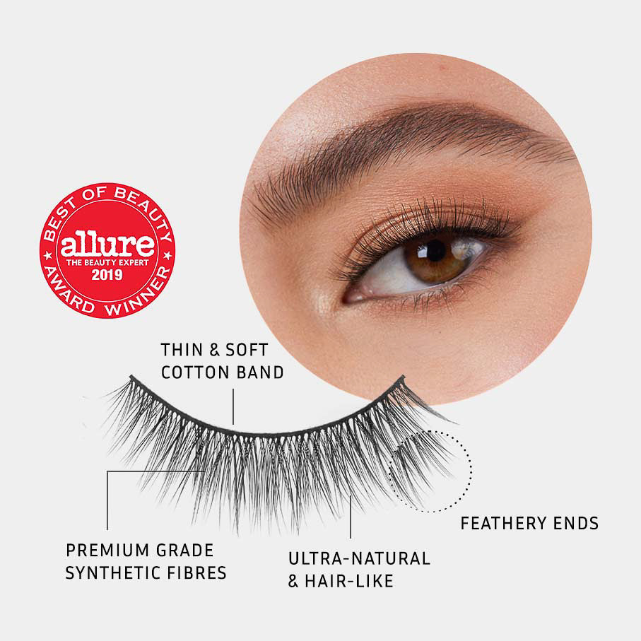 Lithe Lashes Core Collection lash style named 01 Fine and Delicate, a pictogram showing a single false lash in the foreground highlighting the callouts of it having a thin and soft cotton band, it being made of premium grade synthetic fibres, looking ultra-natural and hair-like with feathery ends, all on a light grey background with an image of a model's eye wearing them in the upper right corner, and an Allure Best of Beauty seal in the upper left of the image.