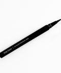 Lithe Lashes false lashes accessories Grip Liner, a 2-in-1 eyeliner lash adhesive. the matte black bottle is open on a white background, showing the ultra fine tip for easy application.